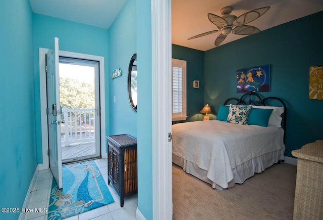 bedroom with access to exterior, ceiling fan, light tile patterned floors, and baseboards