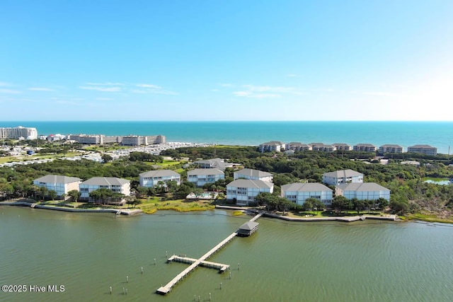 bird's eye view featuring a water view and a residential view