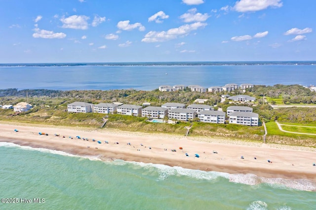 birds eye view of property featuring a water view and a view of the beach