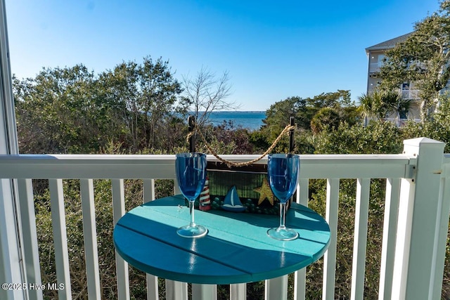 balcony featuring a water view