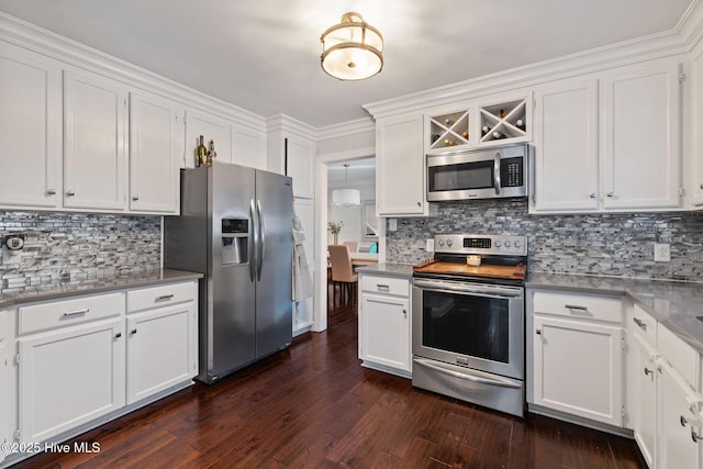 kitchen featuring appliances with stainless steel finishes, white cabinetry, and dark wood-style floors