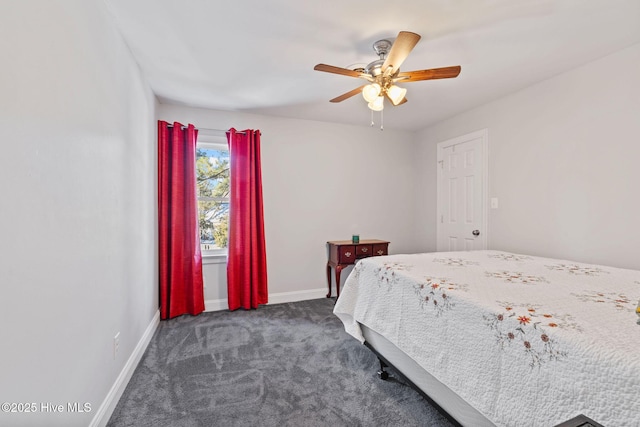 bedroom featuring dark colored carpet, ceiling fan, and baseboards