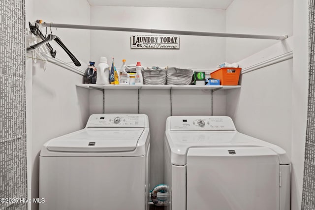 clothes washing area featuring laundry area and washing machine and clothes dryer