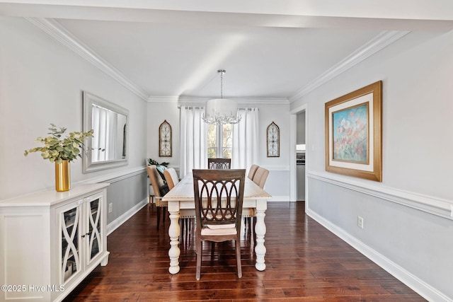 dining space featuring ornamental molding, dark wood finished floors, baseboards, and an inviting chandelier