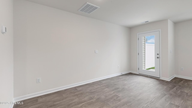 empty room featuring hardwood / wood-style flooring