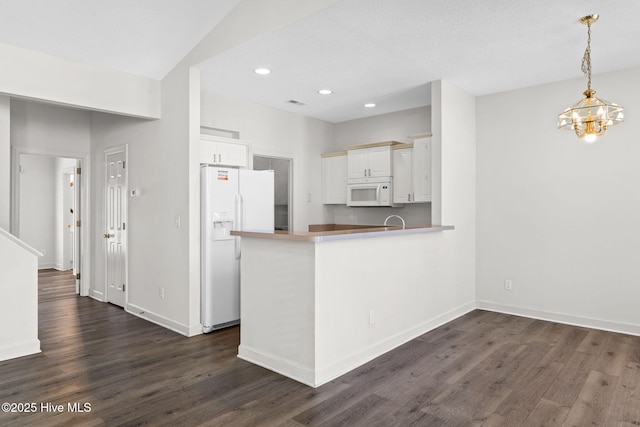 kitchen featuring recessed lighting, baseboards, dark wood-style flooring, and white appliances