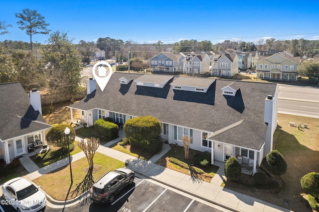 birds eye view of property with a residential view