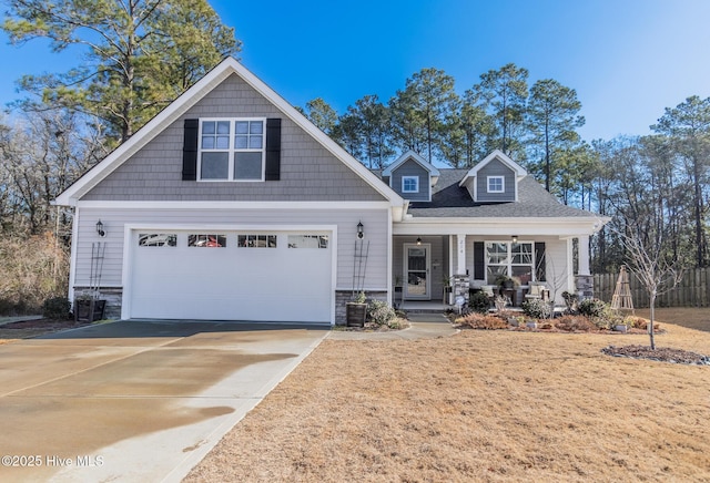 craftsman inspired home with a garage and a porch