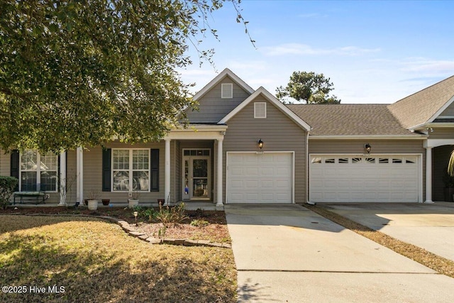 view of front of home with concrete driveway and an attached garage