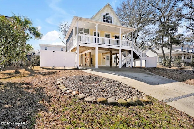 view of front of home featuring covered porch and a carport