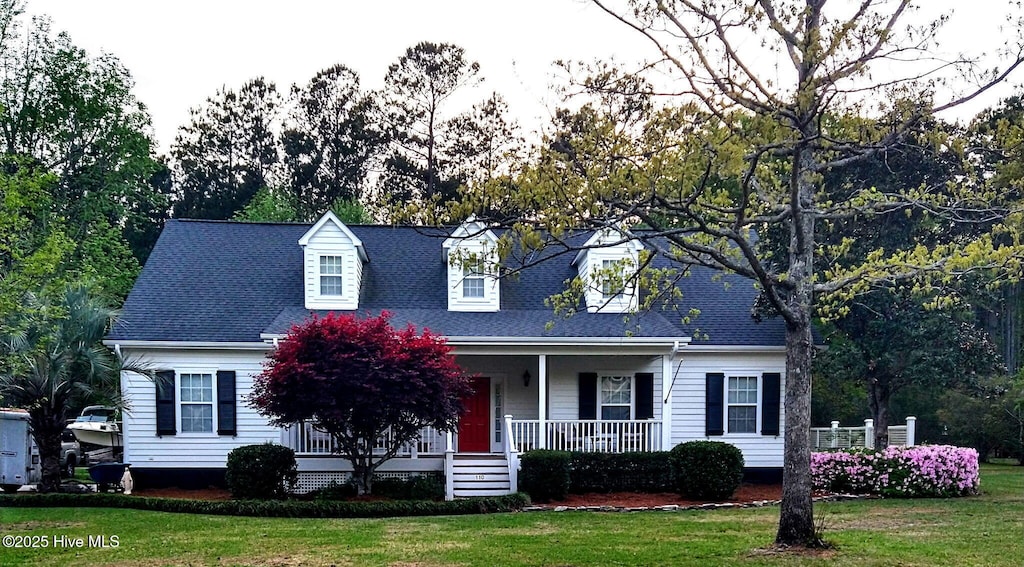 110 E Pointe Rd, Rocky Point, NC 28457 - cape cod house with a front yard, covered porch, and roof with shingles