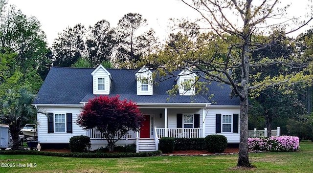 110 E Pointe Rd, Rocky Point, NC 28457 - cape cod house with a front yard, covered porch, and roof with shingles