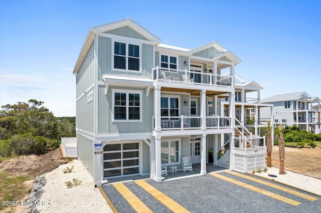 view of front facade featuring a garage and a balcony