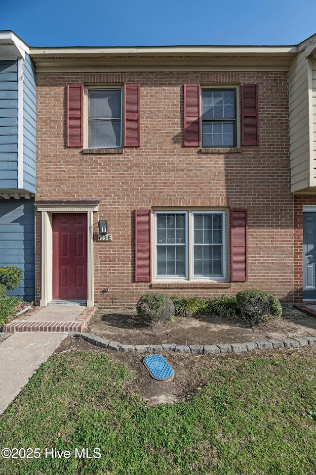 multi unit property featuring brick siding