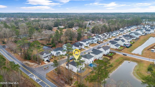 birds eye view of property with a residential view and a water view