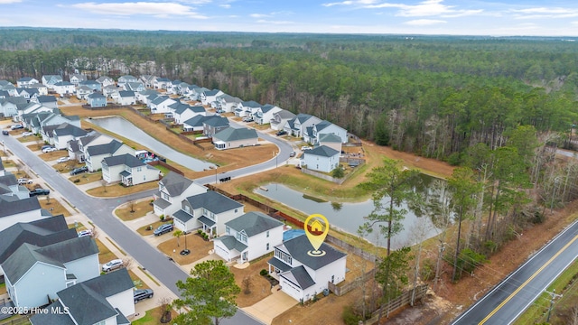 birds eye view of property featuring a residential view and a water view