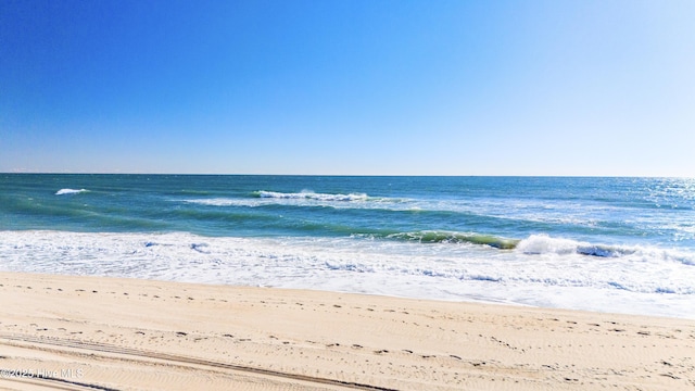 property view of water featuring a beach view