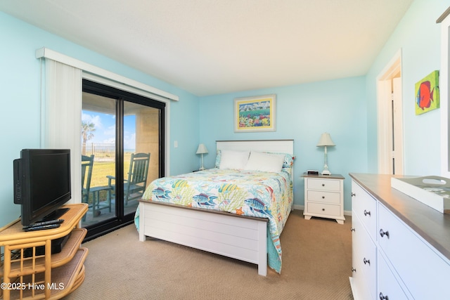 bedroom featuring carpet flooring and access to outside