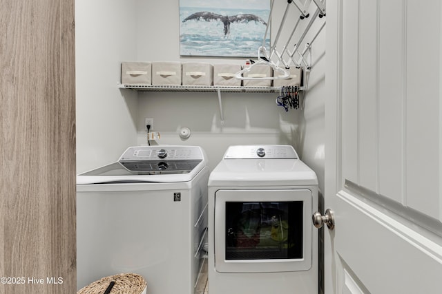 laundry area with laundry area and independent washer and dryer