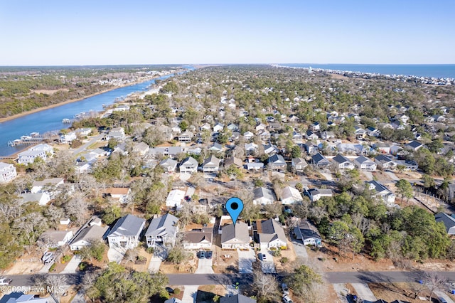 birds eye view of property with a water view and a residential view