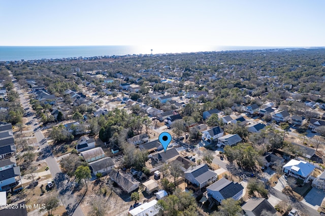 drone / aerial view with a residential view and a water view