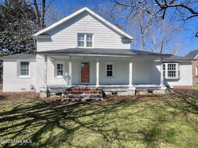 view of front of property featuring covered porch, brick siding, crawl space, and a front yard