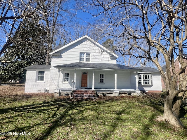 view of front of house featuring crawl space, a porch, a front yard, and brick siding