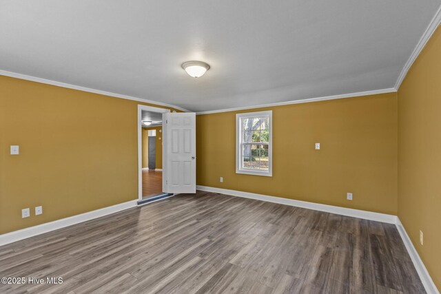 1206 N Bonner St, Washington, NC 27889 - spare room featuring baseboards, wood finished floors, and ornamental molding