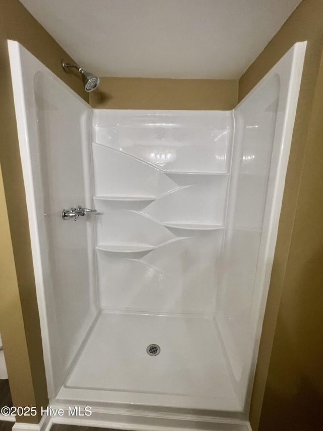 1206 N Bonner St, Washington, NC 27889 - bathroom featuring vanity, baseboards, lofted ceiling, and wood finished floors