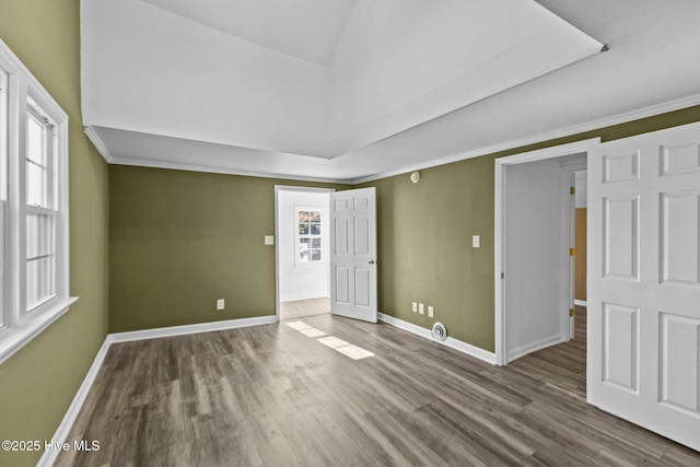 1206 N Bonner St, Washington, NC 27889 - unfurnished room with baseboards, vaulted ceiling, and wood finished floors