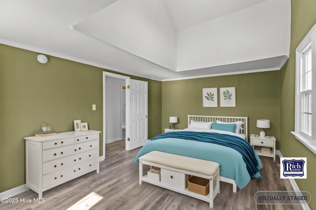 1206 N Bonner St, Washington, NC 27889 - spare room featuring baseboards, vaulted ceiling, and wood finished floors