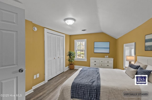 1206 N Bonner St, Washington, NC 27889 - bedroom with baseboards, vaulted ceiling, a closet, and wood finished floors