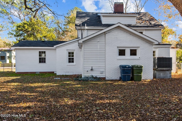 1206 N Bonner St, Washington, NC 27889 - back of house with a chimney, fence, brick siding, a shingled roof, and crawl space
