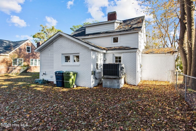 1206 N Bonner St, Washington, NC 27889 - back of house featuring brick siding, fence, and a chimney