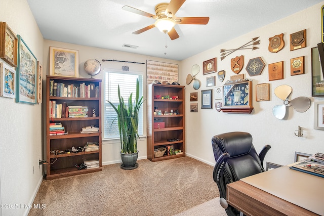 office with carpet floors, visible vents, ceiling fan, a textured ceiling, and baseboards