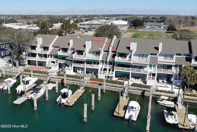 aerial view with a water view and a residential view