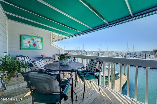 wooden deck with a water view