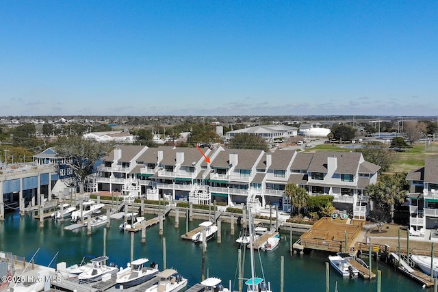 birds eye view of property featuring a residential view and a water view