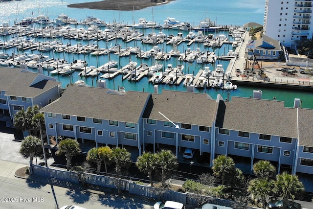 birds eye view of property with a water view