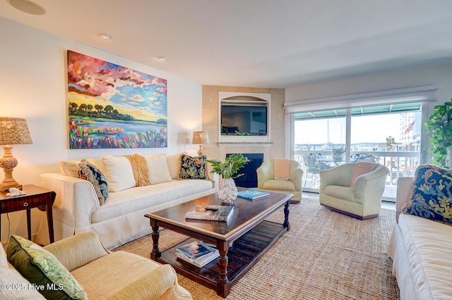living area featuring a large fireplace