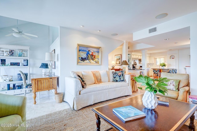 living room with ceiling fan, light tile patterned flooring, recessed lighting, visible vents, and decorative columns