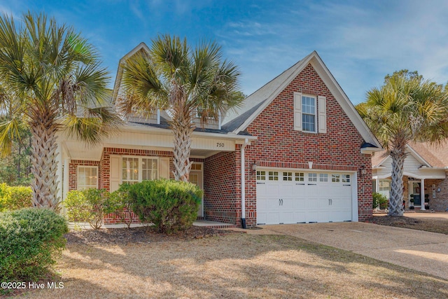 traditional-style home featuring driveway, brick siding, and an attached garage