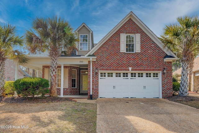 traditional-style home with a porch, brick siding, driveway, and a garage