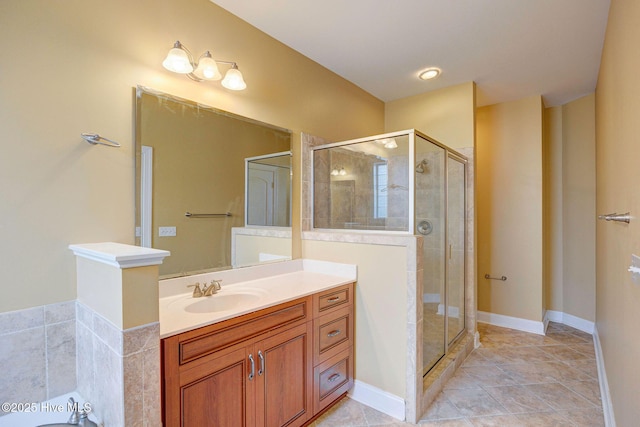 bathroom with tile patterned flooring, baseboards, a shower stall, and vanity