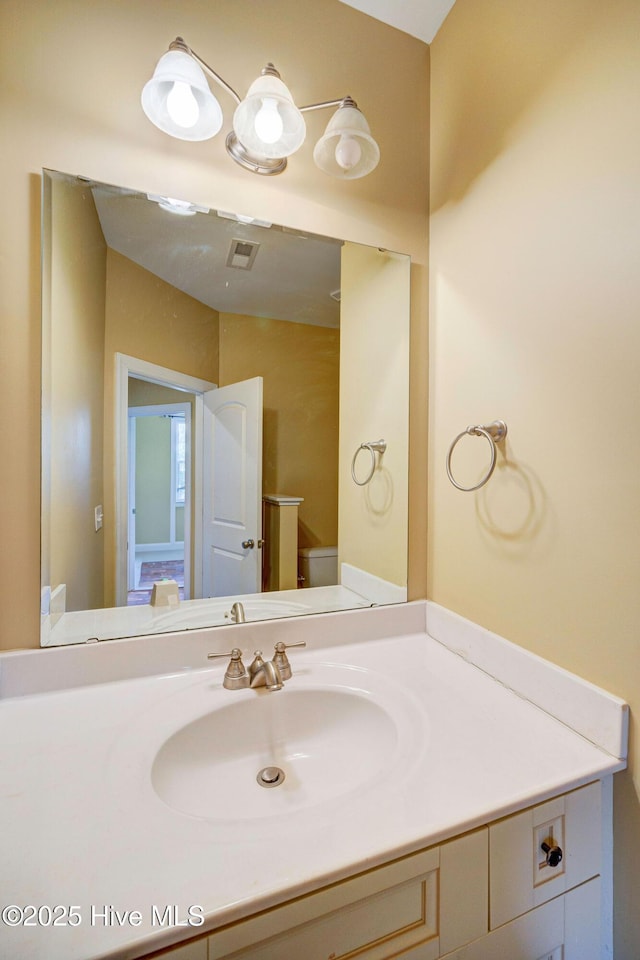 bathroom featuring vanity and visible vents