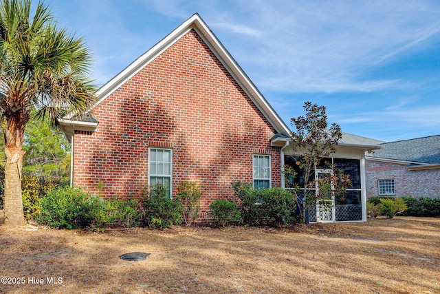 view of side of property with brick siding