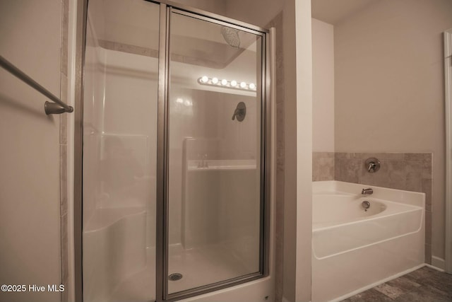 full bathroom with an enclosed shower and a garden tub