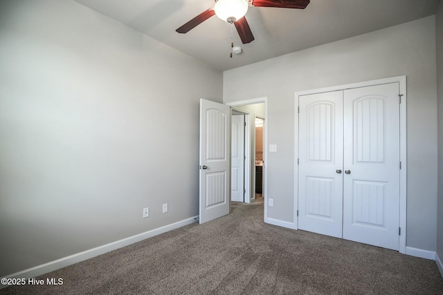 unfurnished bedroom featuring carpet floors, a ceiling fan, baseboards, and a closet