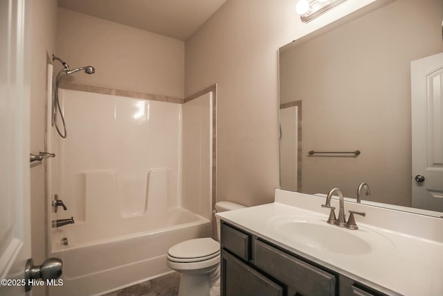 full bath featuring toilet, vanity, and tub / shower combination