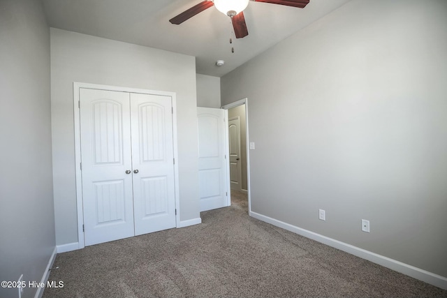 unfurnished bedroom featuring a ceiling fan, a closet, carpet floors, and baseboards